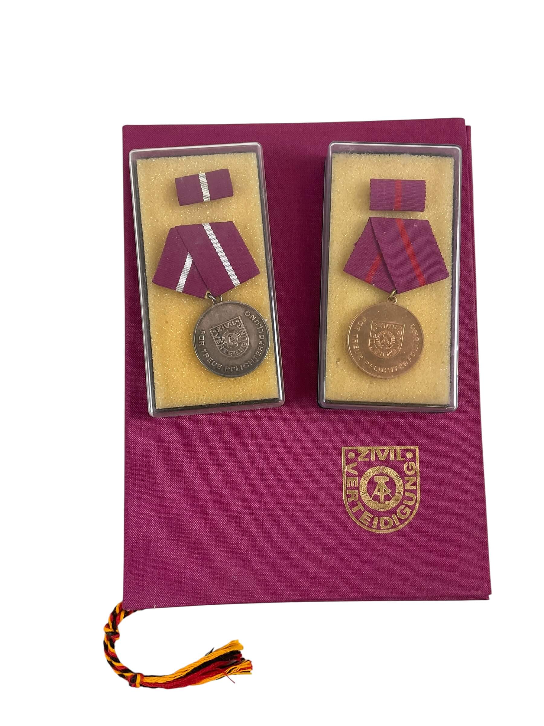 East German DDR Faithful Service X 2 Full Size Medals With Ribbon Bars and Document East German DDR Faithful Service X 2 Full Size Medals With Ribbon Bars and Document