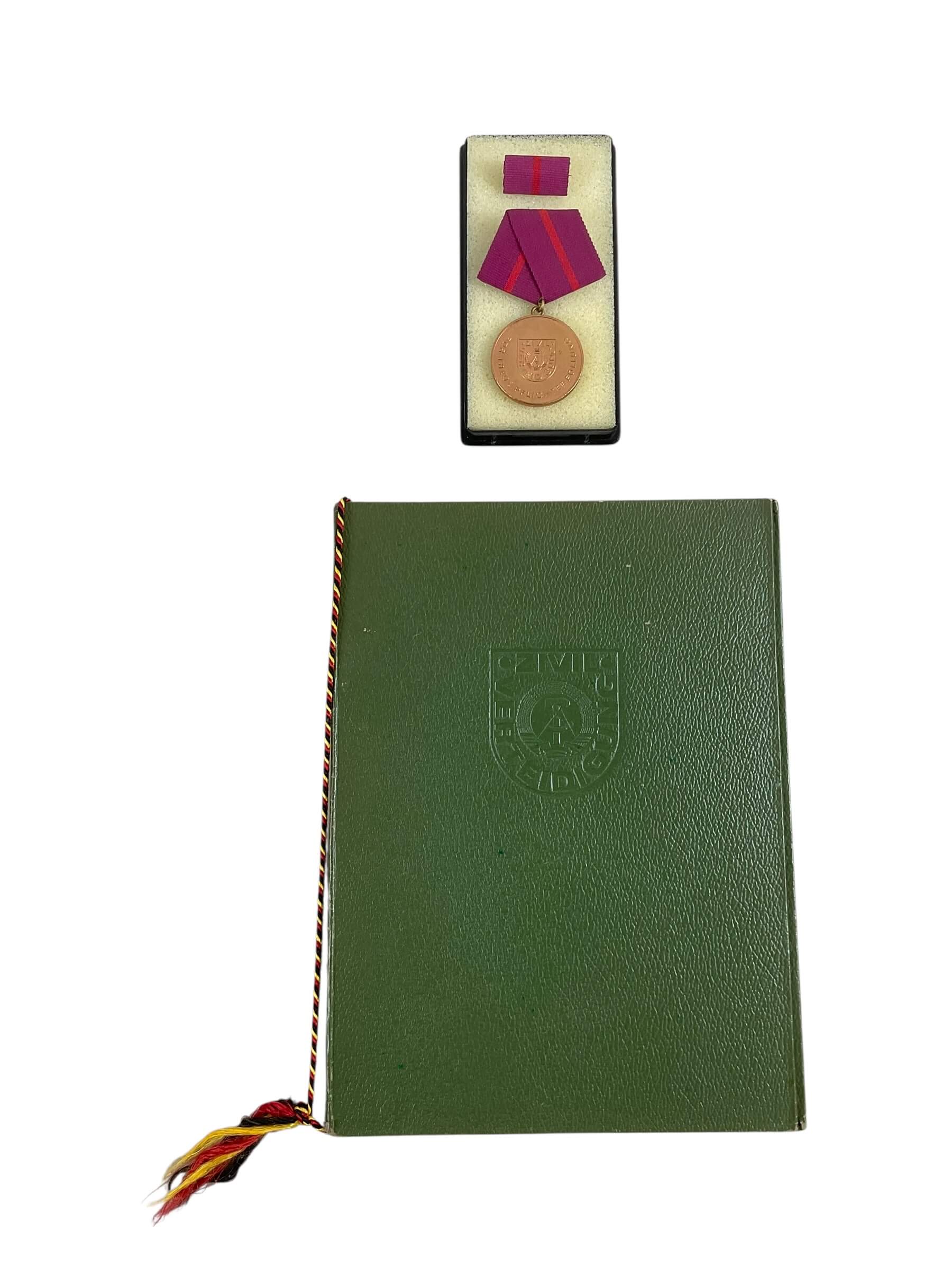 East German GDR/DDR Civil Defense Full Size Medal With Ribbon Bar and Document East German GDR/DDR Civil Defense Full Size Medal With Ribbon Bar and Document