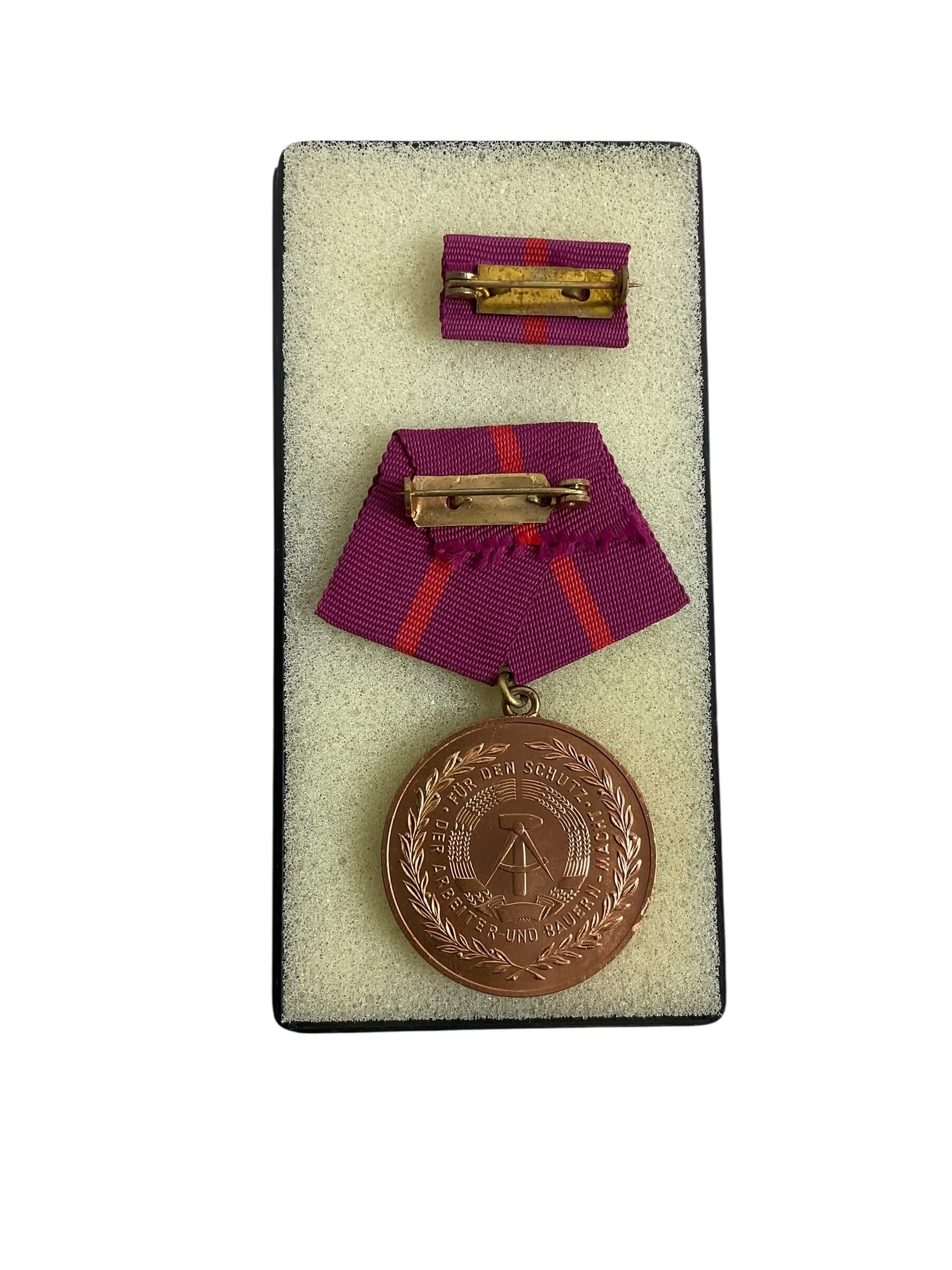 East German GDR/DDR Civil Defense Full Size Medal With Ribbon Bar and Document East German GDR/DDR Civil Defense Full Size Medal With Ribbon Bar and Document