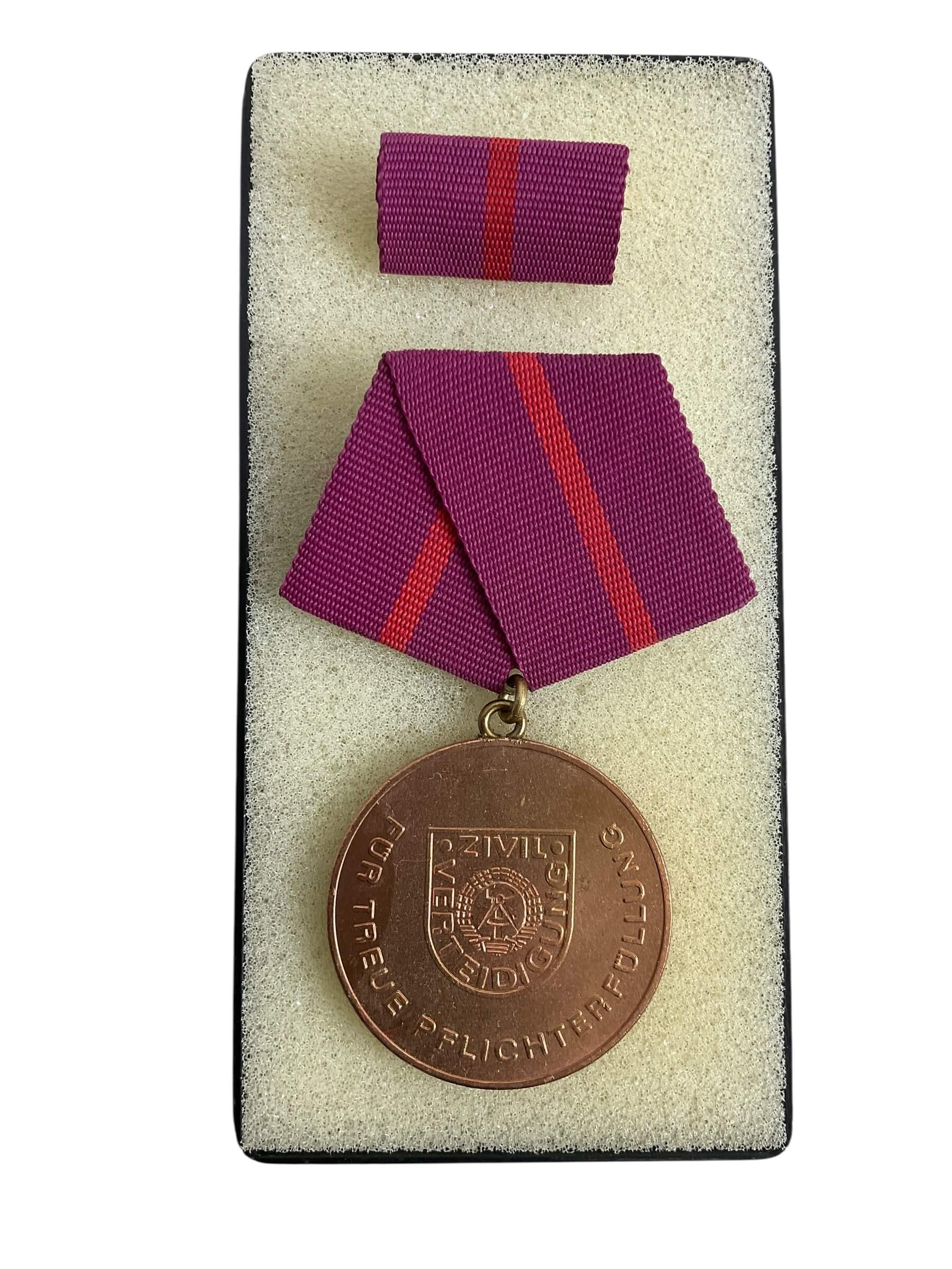 East German GDR/DDR Civil Defense Full Size Medal With Ribbon Bar and Document East German GDR/DDR Civil Defense Full Size Medal With Ribbon Bar and Document