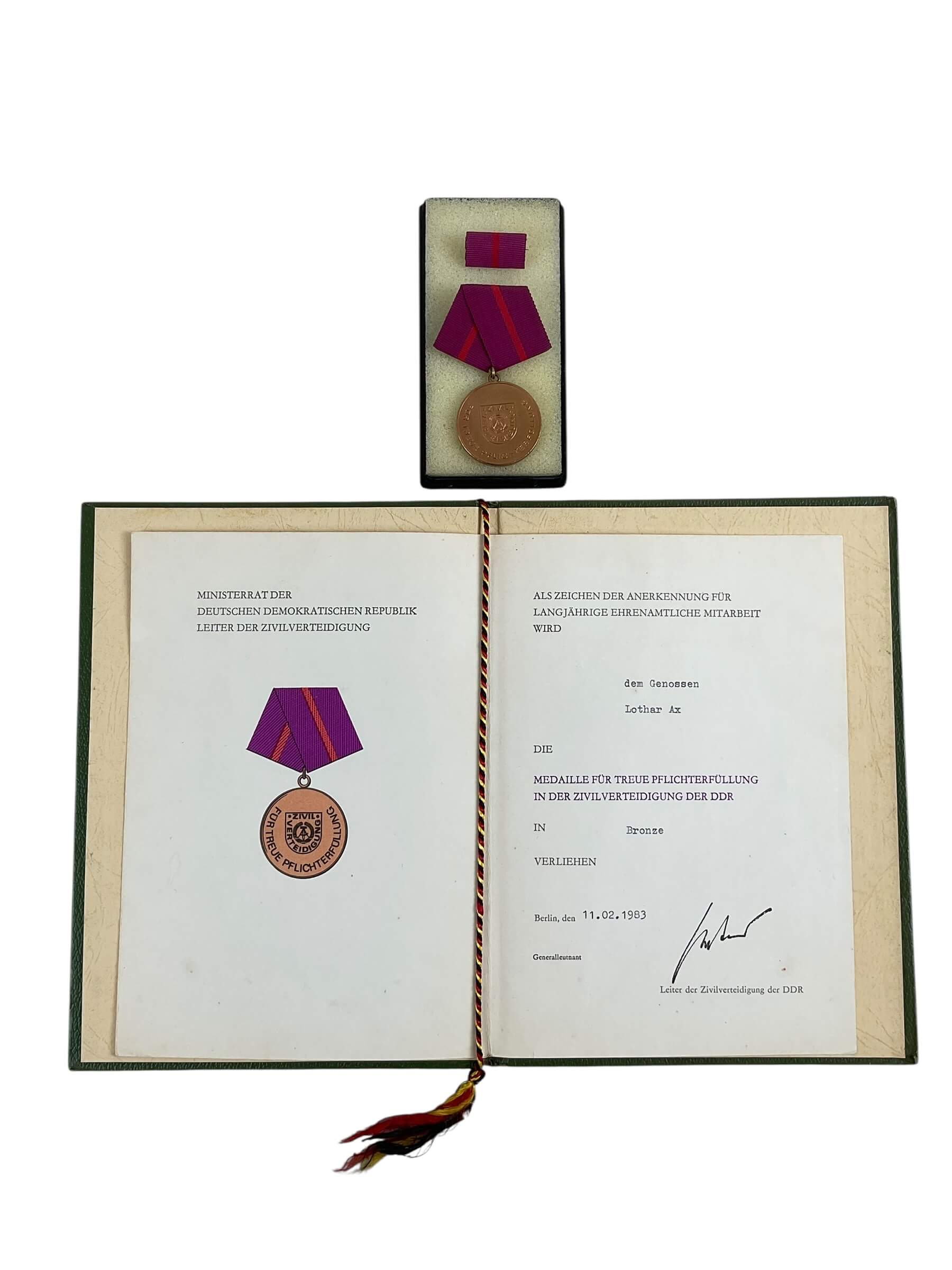 East German GDR/DDR Civil Defense Full Size Medal With Ribbon Bar and Document East German GDR/DDR Civil Defense Full Size Medal With Ribbon Bar and Document