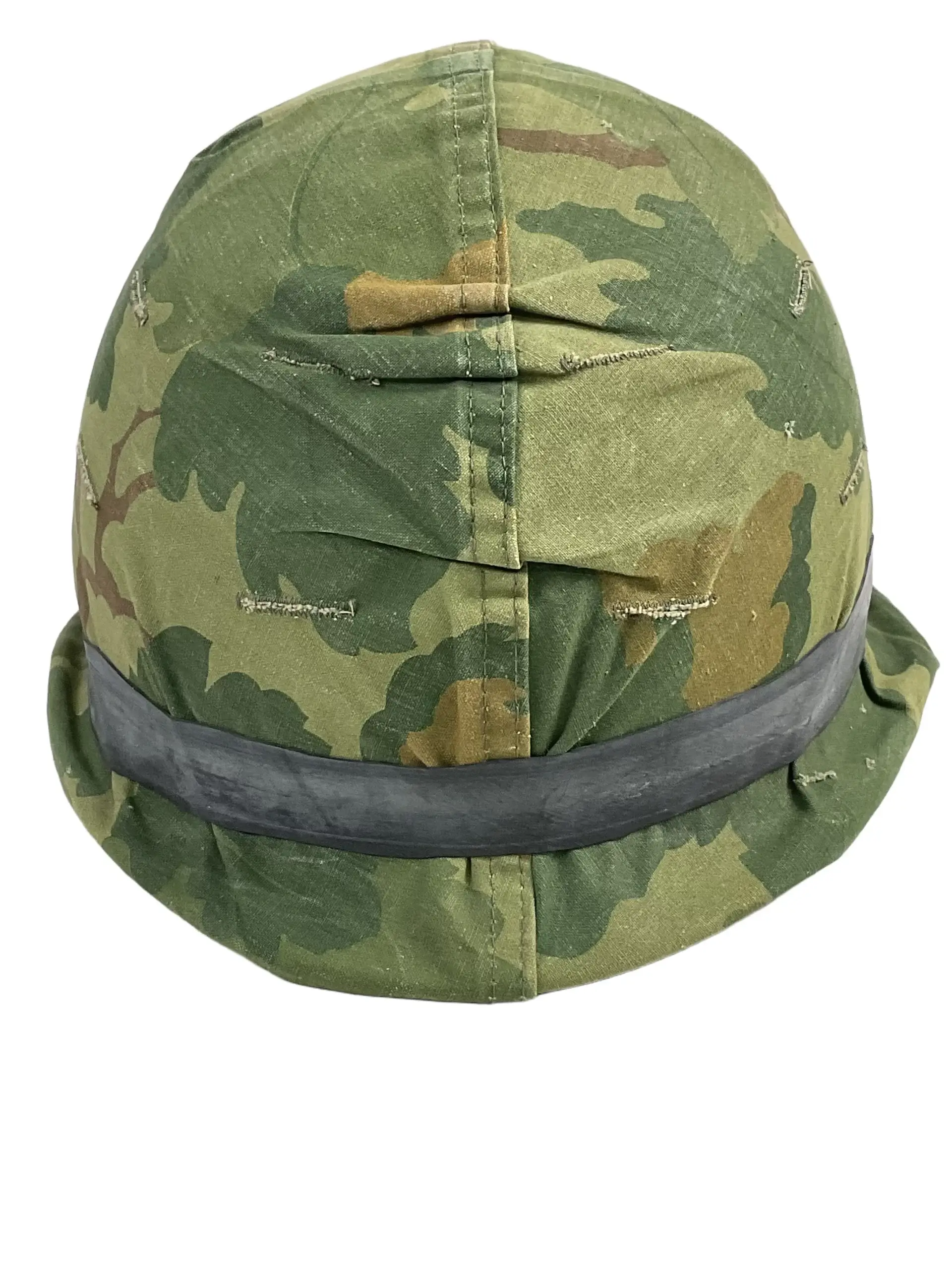 US Army M1 Rear Seam Swivel Bail Steel Helmet With Reversible Camouflage Cover 1964 and 1973 US Army M1 Rear Seam Swivel Bail Steel Helmet With Reversible Camouflage Cover 1964 and 1973