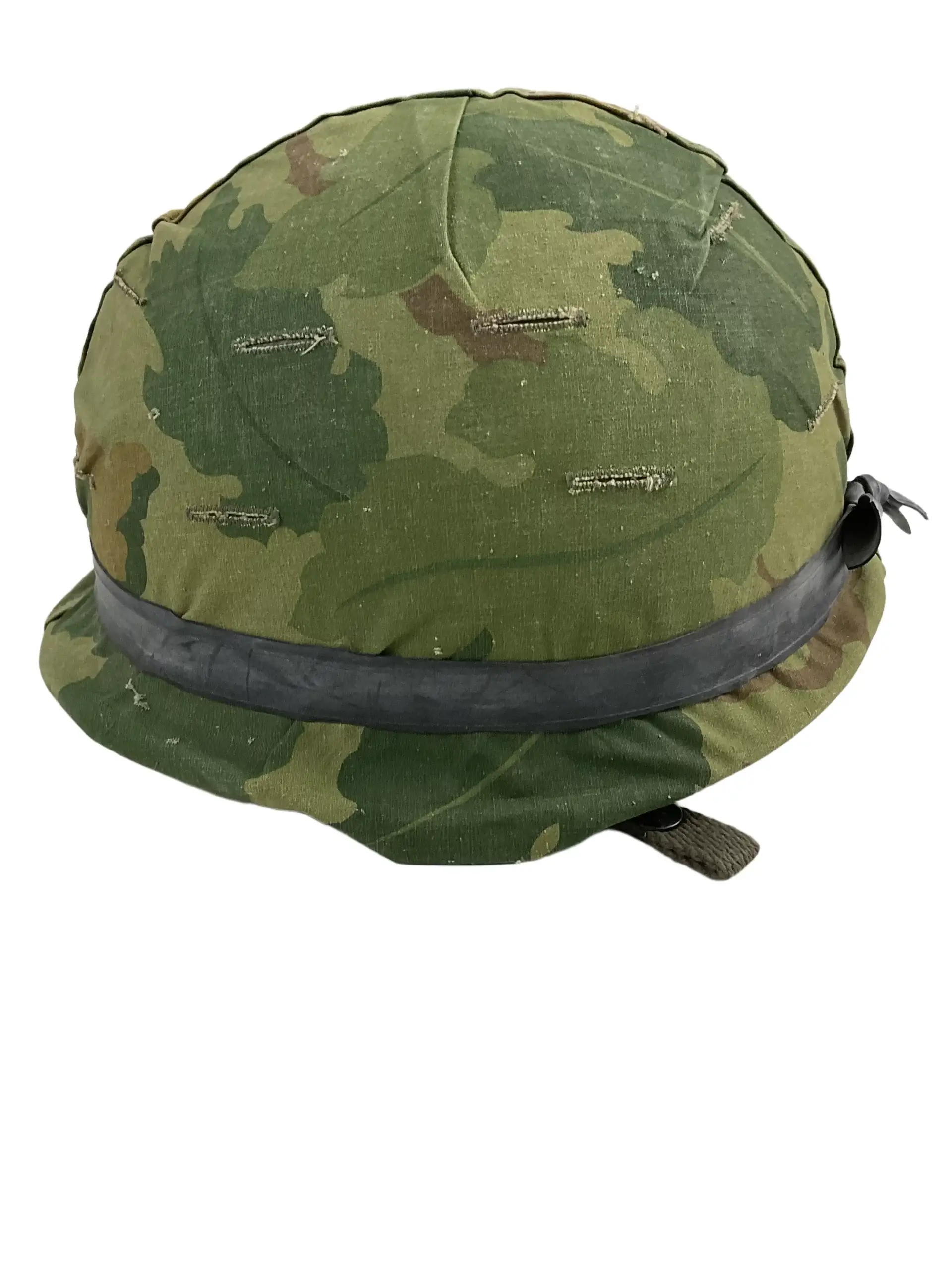 US Army M1 Rear Seam Swivel Bail Steel Helmet With Reversible Camouflage Cover 1964 and 1973 US Army M1 Rear Seam Swivel Bail Steel Helmet With Reversible Camouflage Cover 1964 and 1973