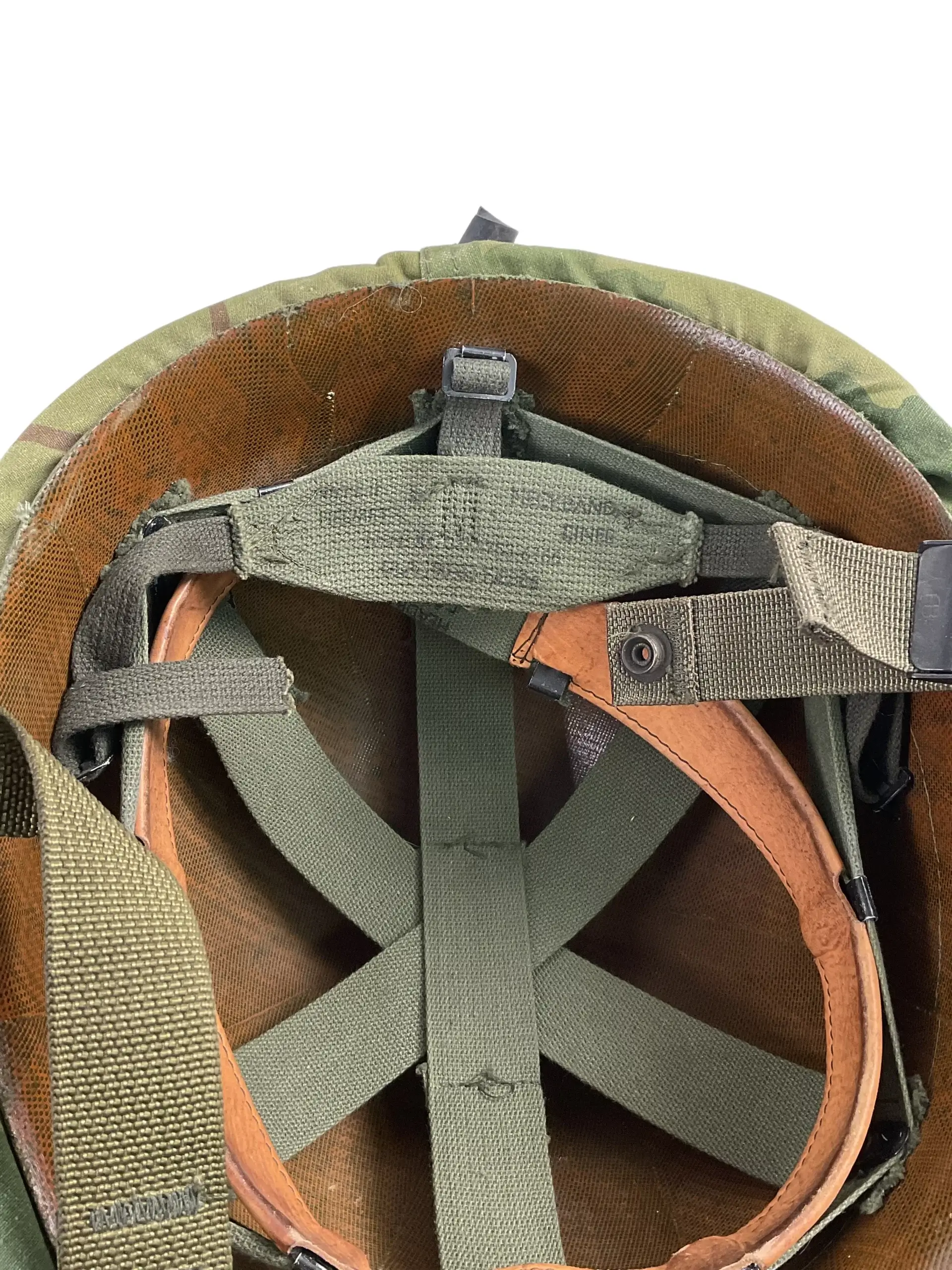 US Army M1 Rear Seam Swivel Bail Steel Helmet With Reversible Camouflage Cover 1964 and 1973 US Army M1 Rear Seam Swivel Bail Steel Helmet With Reversible Camouflage Cover 1964 and 1973